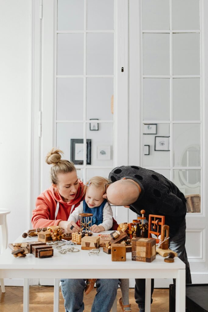 A family bonding session with wooden toys at home, embracing parenthood.